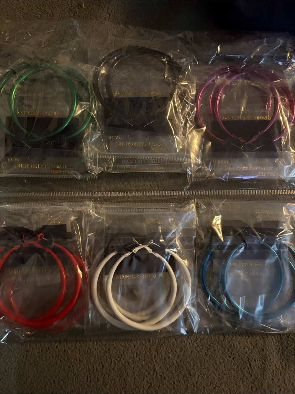 Fashion earrings..12 pk of multicolored hoops ..2 pks of each color shown - Picture 2 of 2